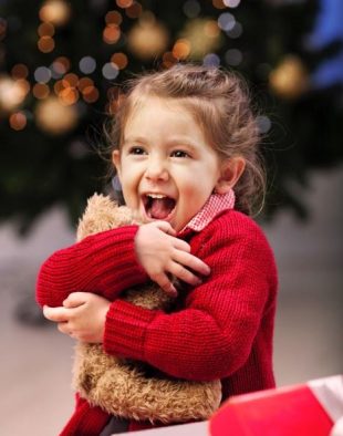 Little girl wearing red sweater